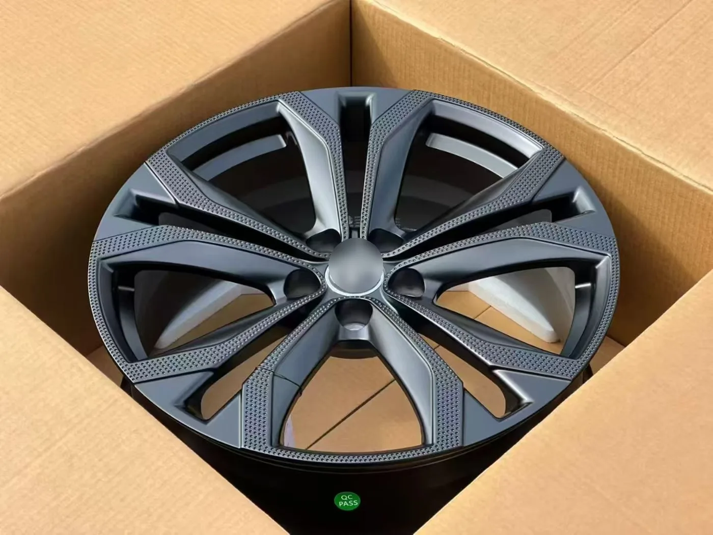 Matte gunmetal wheel after QC, ready for packing